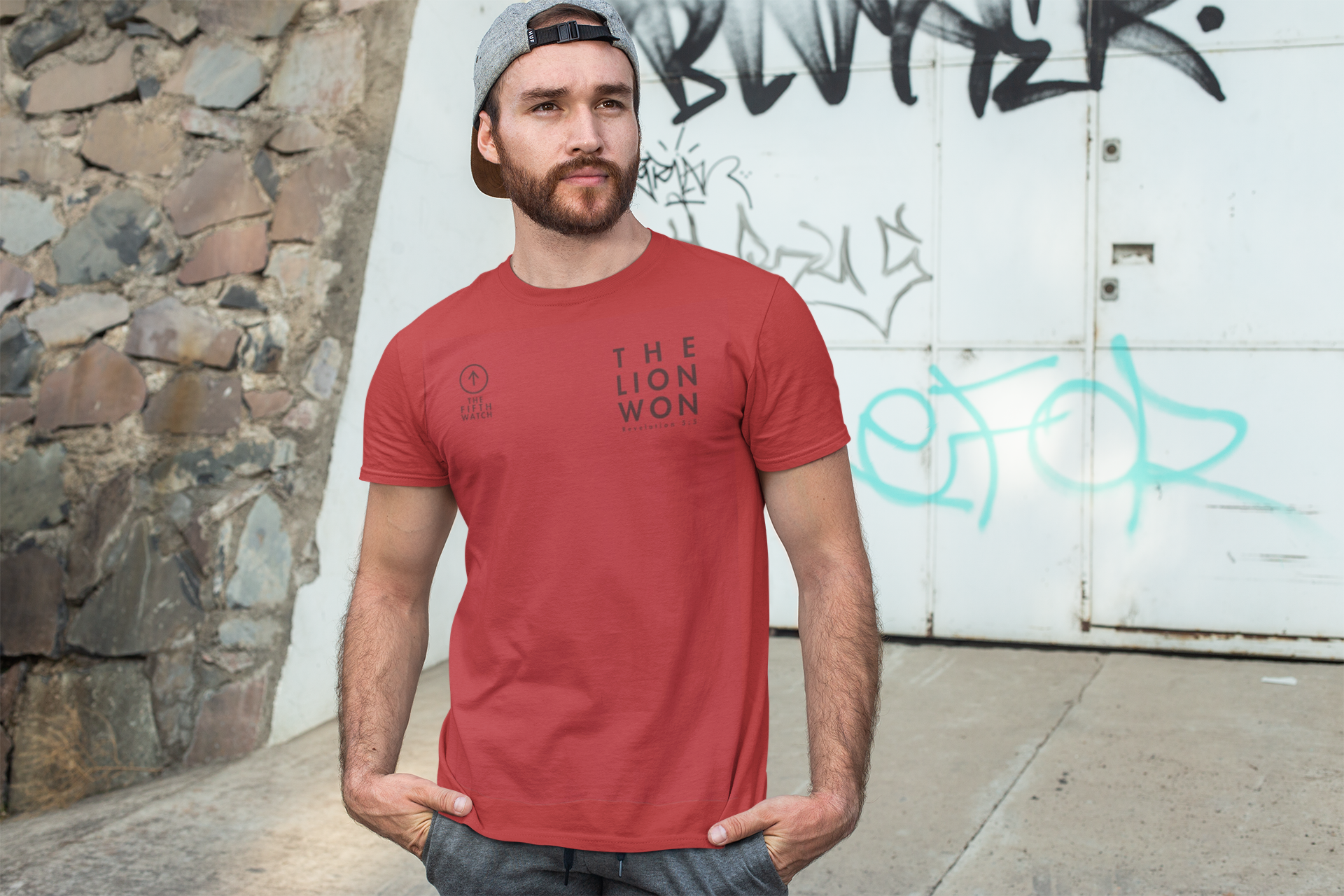 t-shirt-mockup-of-a-man-posing-in-front-of-a-graffiti-wall-28200.png
